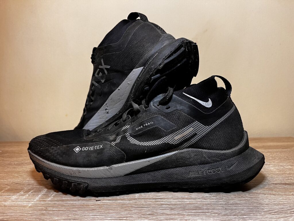 Picture of the Nike Pegasus trail 4 gore-tex from the side with one shoe sitting on top of the other to show the out sole